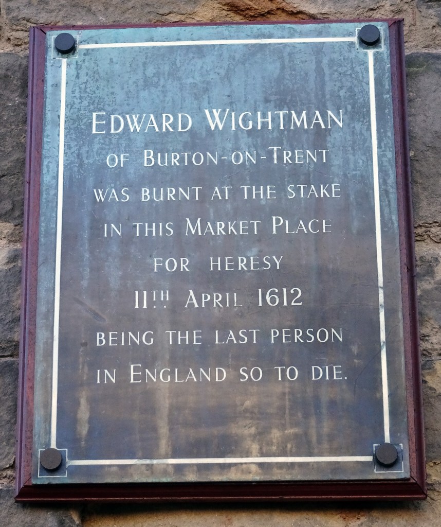 A plaque in Lichfield market place reading: 'Edward Wightman of Burton-on-Trent was burnt at the state in this market place for heresy, 11th April 1612, being the last person in England so to die.'