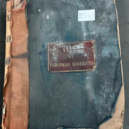 The cover of the atlas (HO 84/3) showing water damage and wear.